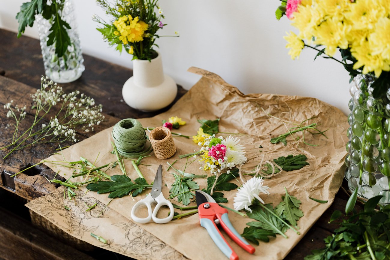 Messy workplace of florist after arranging bouquet